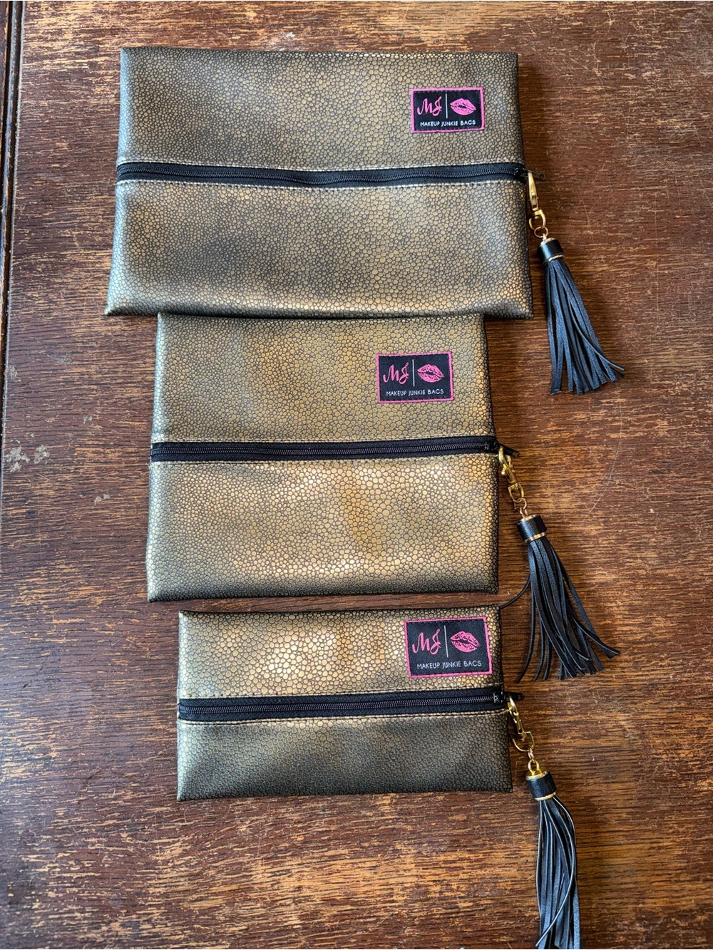 EUC Set of 3 gold Makeup Junkie Bags - mini, small, & medium like new condition